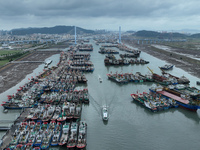 A large number of fishing boats moor at Shenjiamen Fishing Port to avoid Typhoon Bebinca in Zhoushan, China, on September 15, 2024. (