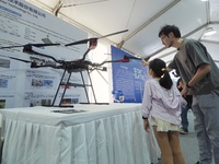 A child visits a ''drone'' during the 14th Beijing Science Carnival in Beijing, China, on September 15, 2024. (