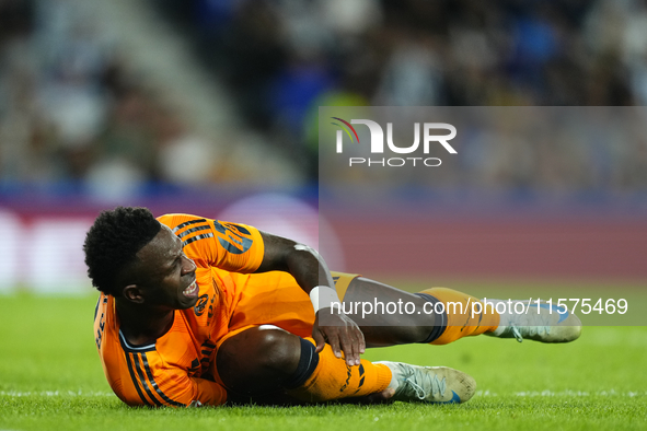 Vinicius Junior left winger of Real Madrid and Brazil lies injured on the pitch during the La Liga match between Real Sociedad de Futbol and...