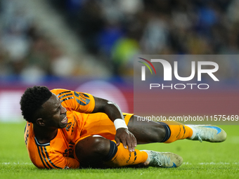 Vinicius Junior left winger of Real Madrid and Brazil lies injured on the pitch during the La Liga match between Real Sociedad de Futbol and...