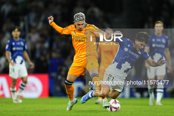 Federico Valverde central midfield of Real Madrid and Uruguay and Aramburu of Real Sociedad and Spain compete for the ball during the La Lig...