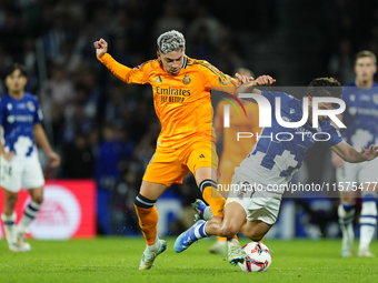 Federico Valverde central midfield of Real Madrid and Uruguay and Aramburu of Real Sociedad and Spain compete for the ball during the La Lig...