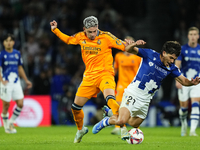 Federico Valverde central midfield of Real Madrid and Uruguay and Aramburu of Real Sociedad and Spain compete for the ball during the La Lig...