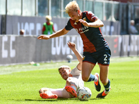 #56 Alexis Saelemaekers of Roma contrasts #2 Morten Thorsby of Genoa during the Serie A ENILIVE 24/25 match between Genoa CFC and AS Roma at...