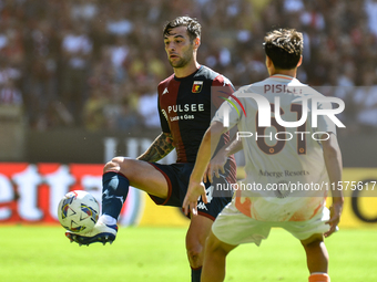 #14 Alessandro Vogliacco of Genoa passes the ball during the Serie A ENILIVE 24/25 match between Genoa CFC and AS Roma at Stadio Luigi Ferra...