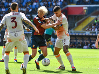 #23 Gianluca Mancini of Roma contrasts #2 Morten Thorsby of Genoa during the Serie A ENILIVE 24/25 match between Genoa CFC and AS Roma at St...