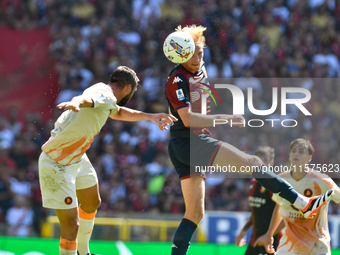 Aerial contrast during the Serie A ENILIVE 24/25 match between Genoa CFC and AS Roma at Stadio Luigi Ferraris in Genova, Italy (