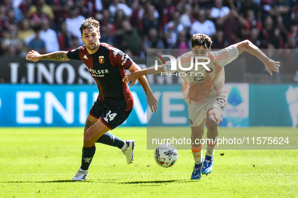 Nicolo Pisilli of Roma contrasts Alessandro Vogliacco of Genoa during the Serie A ENILIVE 24/25 match between Genoa CFC and AS Roma at Stadi...