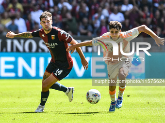 Nicolo Pisilli of Roma contrasts Alessandro Vogliacco of Genoa during the Serie A ENILIVE 24/25 match between Genoa CFC and AS Roma at Stadi...