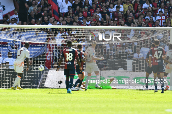 Artem Dobvik scores his team's first goal to make the score 0-1 during the Serie A ENILIVE 24/25 match between Genoa CFC and AS Roma at Stad...