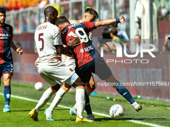 Evan Ndicka of Roma contrasts Andrea Pinamonti of Genoa during the Serie A ENILIVE 24/25 match between Genoa CFC and AS Roma at Stadio Luigi...