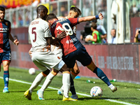 Evan Ndicka of Roma contrasts Andrea Pinamonti of Genoa during the Serie A ENILIVE 24/25 match between Genoa CFC and AS Roma at Stadio Luigi...