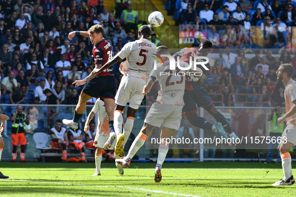 Aerial contrast during the Serie A ENILIVE 24/25 match between Genoa CFC and AS Roma at Stadio Luigi Ferraris in Genova, Italy 