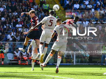 Aerial contrast during the Serie A ENILIVE 24/25 match between Genoa CFC and AS Roma at Stadio Luigi Ferraris in Genova, Italy (