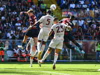 Aerial contrast during the Serie A ENILIVE 24/25 match between Genoa CFC and AS Roma at Stadio Luigi Ferraris in Genova, Italy (