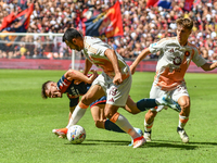 #19 Zeki Celik of Roma contrasts #9 Vitinha of Genoa during the Serie A ENILIVE 24/25 match between Genoa CFC and AS Roma at Stadio Luigi Fe...