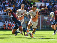 #23 Gianluca Mancini of Roma contrasts #4 Koni De Winter of Genoa during the Serie A ENILIVE 24/25 match between Genoa CFC and AS Roma at St...