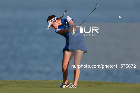 GAINESVILLE, VIRGINIA - SEPTEMBER 14: Georgia Hall of Team Europe hits to the 17th green during Day Two of the Solheim Cup at Robert Trent J...