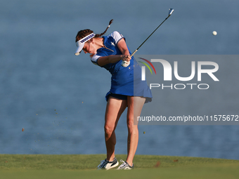 GAINESVILLE, VIRGINIA - SEPTEMBER 14: Georgia Hall of Team Europe hits to the 17th green during Day Two of the Solheim Cup at Robert Trent J...