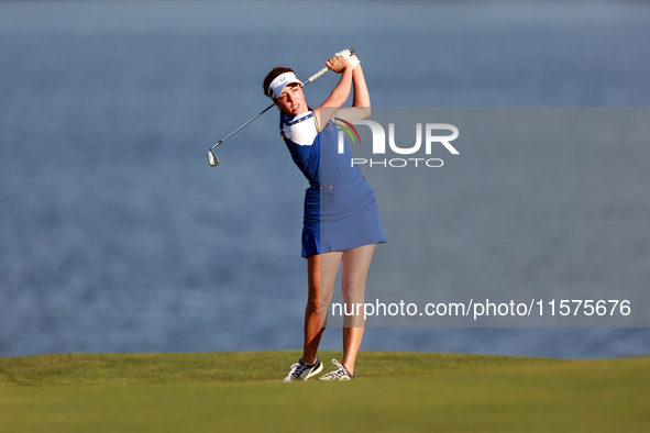 GAINESVILLE, VIRGINIA - SEPTEMBER 14: Georgia Hall of Team Europe hits to the 17th green during Day Two of the Solheim Cup at Robert Trent J...