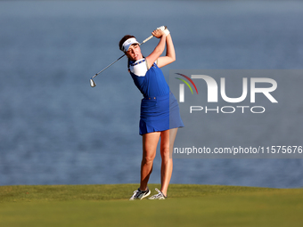 GAINESVILLE, VIRGINIA - SEPTEMBER 14: Georgia Hall of Team Europe hits to the 17th green during Day Two of the Solheim Cup at Robert Trent J...