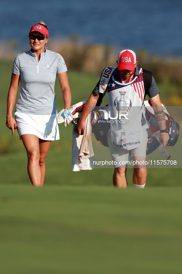 GAINESVILLE, VIRGINIA - SEPTEMBER 14: Lexi Thompson of the United States walks with her caddie on the 17th fairway during Day Two of the Sol...