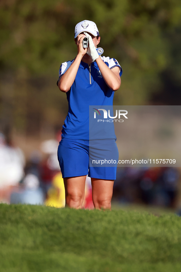 GAINESVILLE, VIRGINIA - SEPTEMBER 14: Carlota Ciganda of Team Europ looks through a rangefinder down the 17th fairway during Day Two of the...