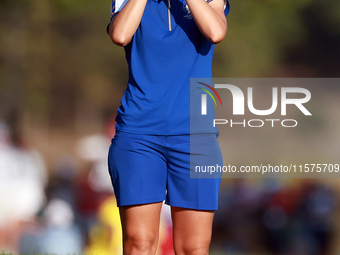 GAINESVILLE, VIRGINIA - SEPTEMBER 14: Carlota Ciganda of Team Europ looks through a rangefinder down the 17th fairway during Day Two of the...