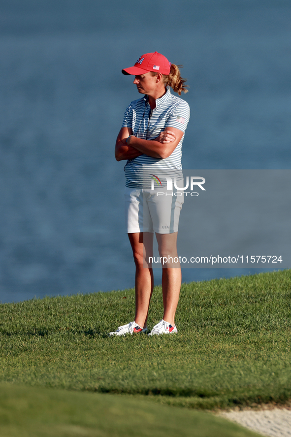 GAINESVILLE, VIRGINIA - SEPTEMBER 14: Captain Stacy Lewis of the United States watches Lexi Thompson of the United States at the 17th fairwa...