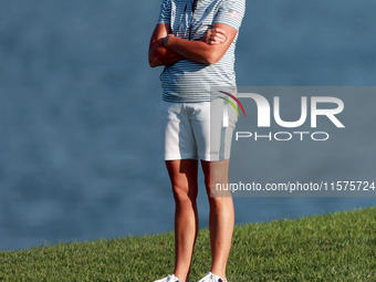 GAINESVILLE, VIRGINIA - SEPTEMBER 14: Captain Stacy Lewis of the United States watches Lexi Thompson of the United States at the 17th fairwa...