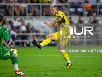 Columbus attacker Christian Ramirez takes a shot during the 'Hell is Real' Major League Soccer match between FC Cincinnati and the Columbus...