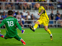 Columbus attacker Christian Ramirez takes a shot during the 'Hell is Real' Major League Soccer match between FC Cincinnati and the Columbus...