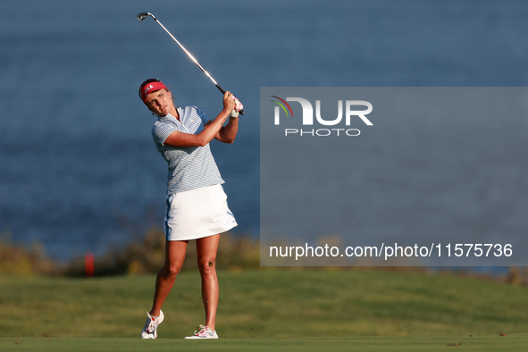 GAINESVILLE, VIRGINIA - SEPTEMBER 14: Lexi Thompson of the United States hits from the 17th fairway during Day Two of the Solheim Cup at Rob...