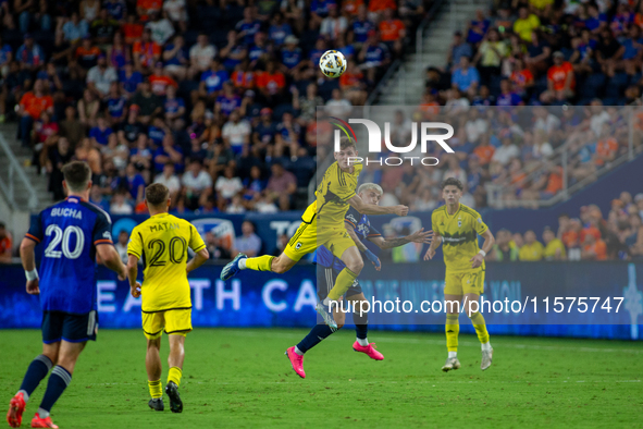 Players compete to head the ball during the 'Hell is Real' Major League Soccer match between FC Cincinnati and the Columbus Crew at TQL Stad...