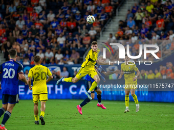 Players compete to head the ball during the 'Hell is Real' Major League Soccer match between FC Cincinnati and the Columbus Crew at TQL Stad...