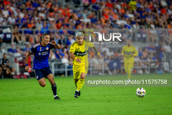 Cincinnati midfielder Yuya Kubo and Columbus attacker Cucho Hernandez compete for the ball during the 'Hell is Real' Major League Soccer mat...