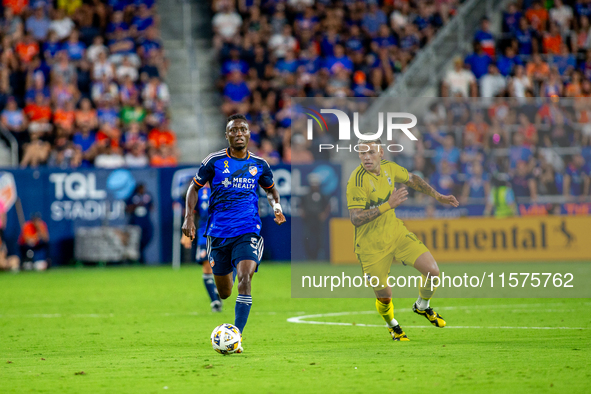 Cincinnati midfielder Obinna Nwobodo moves the ball upfield during the 'Hell is Real' Major League Soccer match between FC Cincinnati and th...