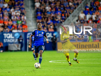 Cincinnati midfielder Obinna Nwobodo moves the ball upfield during the 'Hell is Real' Major League Soccer match between FC Cincinnati and th...