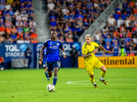 Cincinnati midfielder Obinna Nwobodo moves the ball upfield during the 'Hell is Real' Major League Soccer match between FC Cincinnati and th...