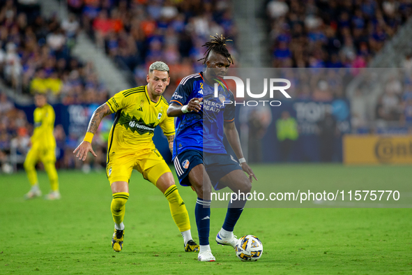 Cincinnati defender Chidozie Awaziem moves the ball upfield during the 'Hell is Real' Major League Soccer match between FC Cincinnati and th...