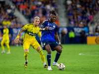 Cincinnati defender Chidozie Awaziem moves the ball upfield during the 'Hell is Real' Major League Soccer match between FC Cincinnati and th...