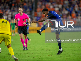 Cincinnati defender Alvas Powell takes a shot during the 'Hell is Real' Major League Soccer match between FC Cincinnati and the Columbus Cre...