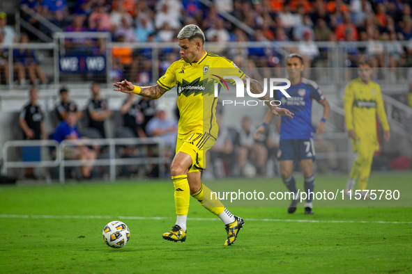 Columbus attacker Christian Ramirez moves the ball upfield during the 'Hell is Real' Major League Soccer match between FC Cincinnati and the...