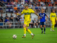 Columbus attacker Christian Ramirez moves the ball upfield during the 'Hell is Real' Major League Soccer match between FC Cincinnati and the...