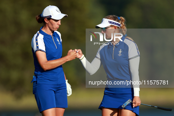 GAINESVILLE, VIRGINIA - SEPTEMBER 14: Carlota Ciganda of Team Europe celebrates with Emily Kristine Pedersen of Team Europe on the 17th fair...