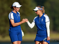 GAINESVILLE, VIRGINIA - SEPTEMBER 14: Carlota Ciganda of Team Europe celebrates with Emily Kristine Pedersen of Team Europe on the 17th fair...