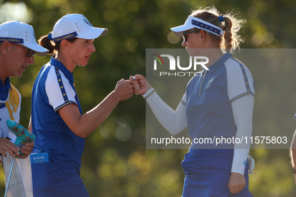 GAINESVILLE, VIRGINIA - SEPTEMBER 14: Carlota Ciganda of Team Europe celebrates with Emily Kristine Pedersen of Team Europe on the 17th gree...