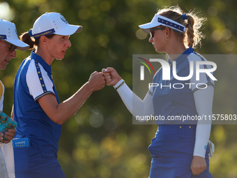 GAINESVILLE, VIRGINIA - SEPTEMBER 14: Carlota Ciganda of Team Europe celebrates with Emily Kristine Pedersen of Team Europe on the 17th gree...