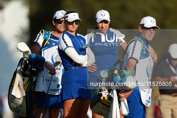 GAINESVILLE, VIRGINIA - SEPTEMBER 14: Carlota Ciganda of Team Europe  and Emily Kristine Pedersen of Team Europe look with their caddies dow...