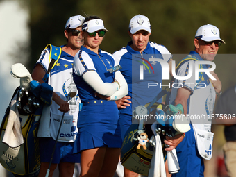 GAINESVILLE, VIRGINIA - SEPTEMBER 14: Carlota Ciganda of Team Europe  and Emily Kristine Pedersen of Team Europe look with their caddies dow...